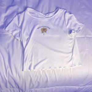 A 10 year old girl white sunflower shirt from shein.